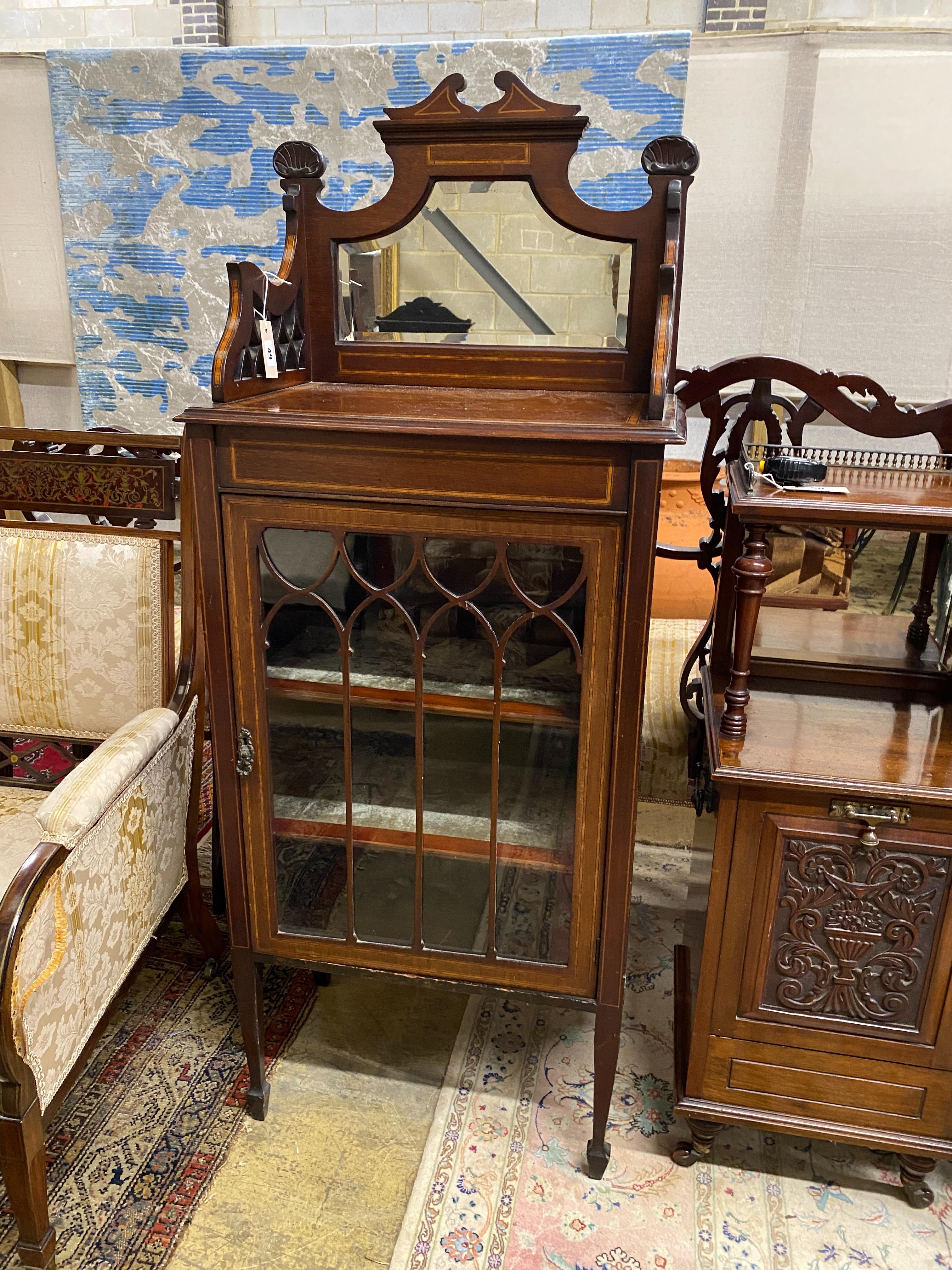 An Edwardian satinwood banded mahogany mirrored back music cabinet, width 56cm, depth 36cm, height 140cm